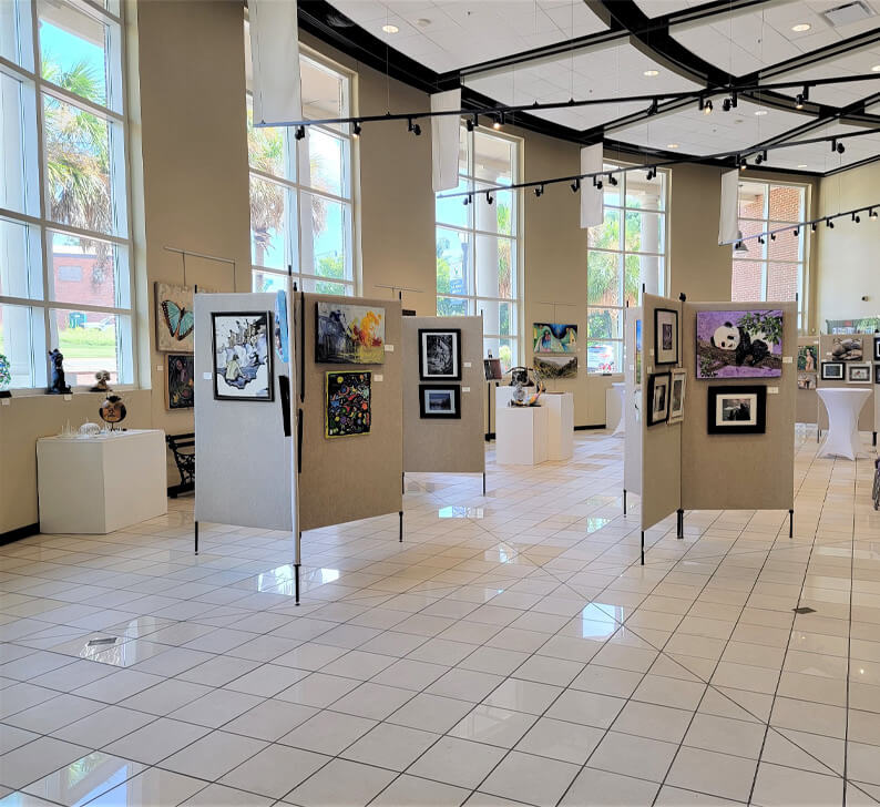 Painting are hung for exhibit in the Arts & Heritage Center in North Augusta SC